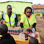 Dr. Susan serving kids alongside Rotary and our Staff